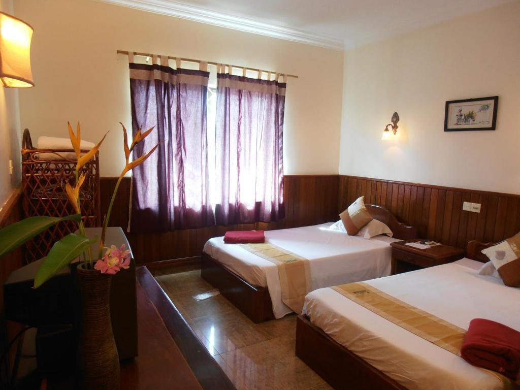 Firefly Guesthouse - The Berlin Angkor Sziemreap Szoba fotó
